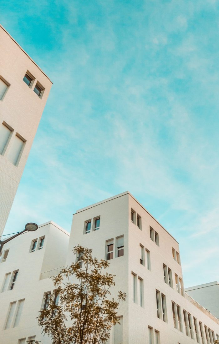 wormview photo of building under cloudy sky
