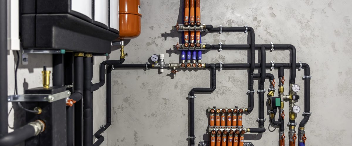 A modern electric boiler room. Equipment for modern heating system as a boiler, heater,pipes, expansion tank and other.